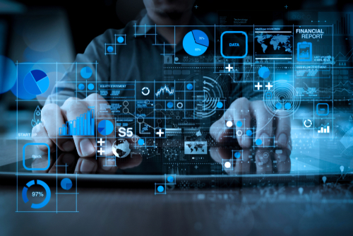 People on computer with data graphics