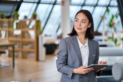 Asian woman on iPad