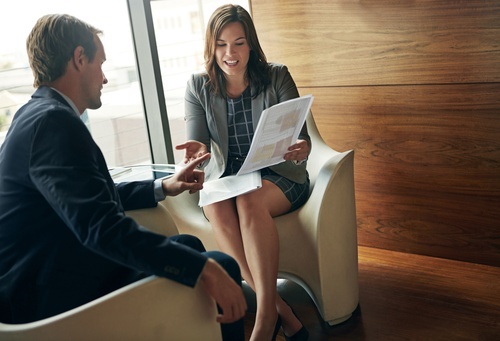 Two people discussing membership