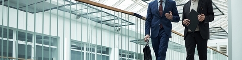 Two business men walking