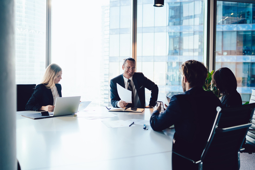 People in Boardroom discussing governance